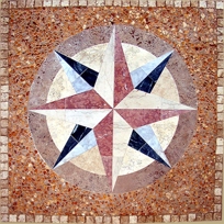 Honed Compass on Pebble Field
