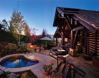COPPER KIDNEY SHAPED SPA WITH BENCH SEATING AND DESCENDING STAIRWAY