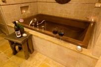 COPPER WHIRPOOL SOAKING BATH WITH CONTOURED BOTTOM