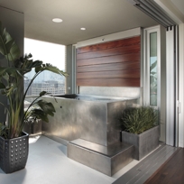 STAINLESS STEEL SPA WITH CUSTOM STAINLESS STEEL PANEL AND TEAK WATER WALL