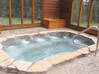 STAINLESS STEEL SPA WITH INTERIOR DESCENDING STAIRWAY AND EIGHT BUCKET SEATS